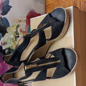 Black Michael Kors Wedge sandals.